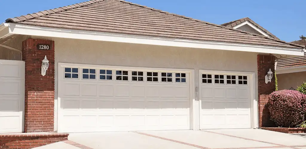 Residential garage door repair service for a double garage door in Erie, PA
